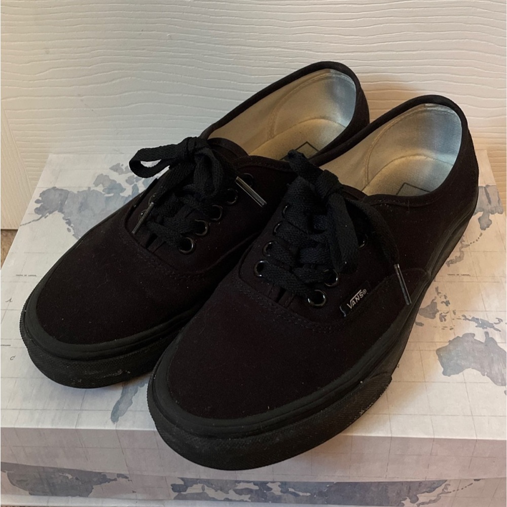 Black low top canvas vans